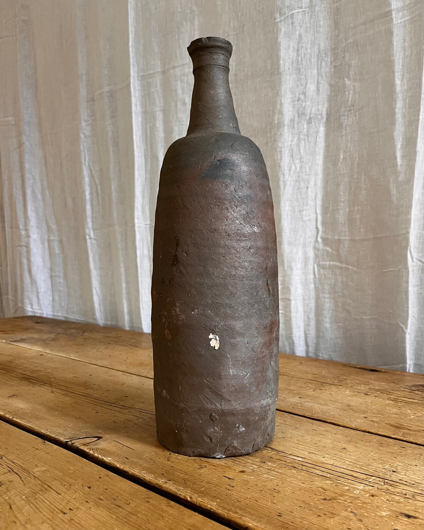 A Set Of French Clay Irregular Cider Bottles