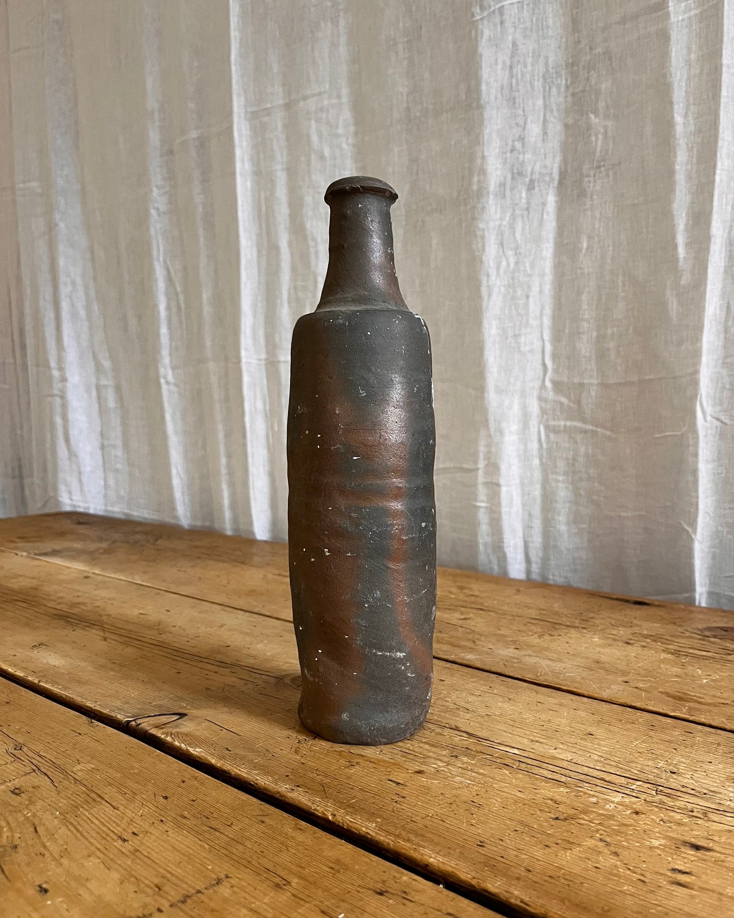 A Set Of French Clay Irregular Cider Bottles