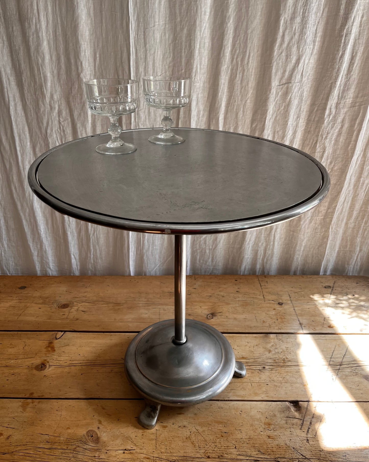Vintage 1930s Art Deco stainless steel bistro coffee table with vintage french coupe glassware