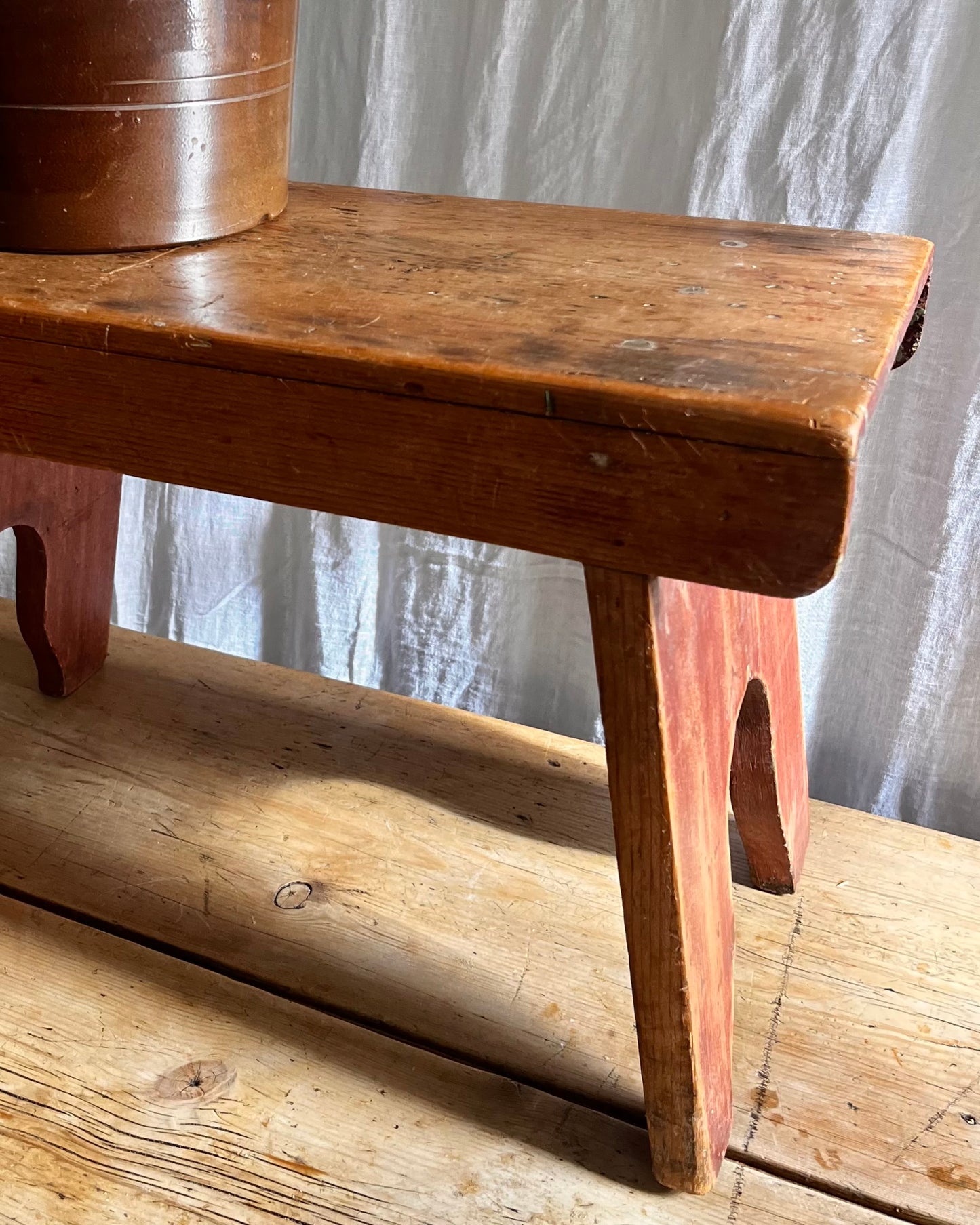 Antique country farm house wooden foot stool with a vintage french ceramic kitchen storage utensil holder