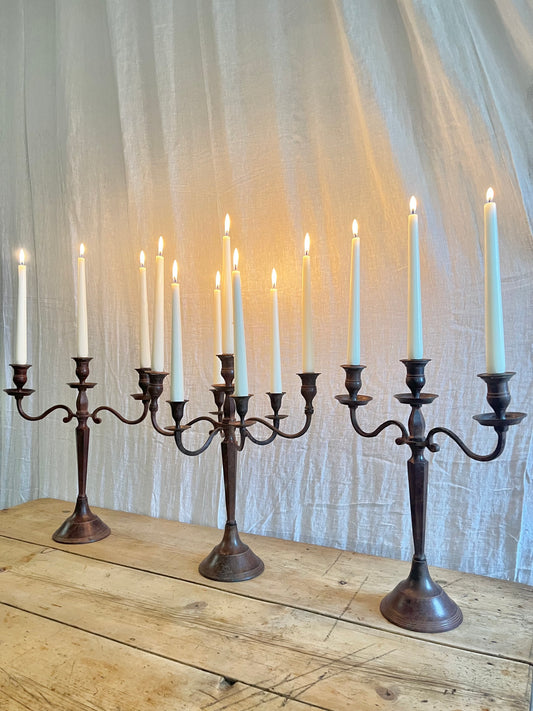 Three antique Edwardian cast metal candelabras 