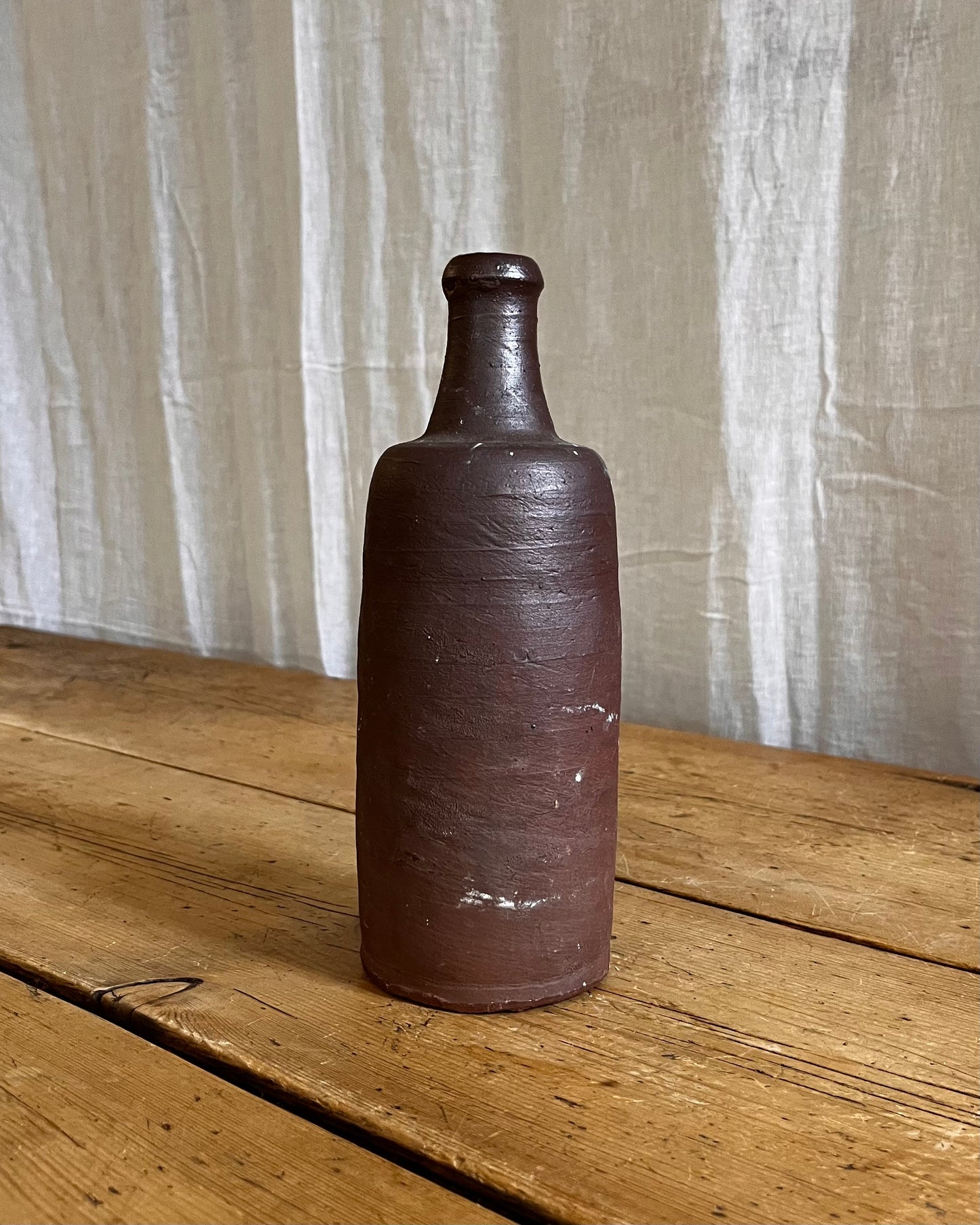 A Set Of French Clay Irregular Cider Bottles