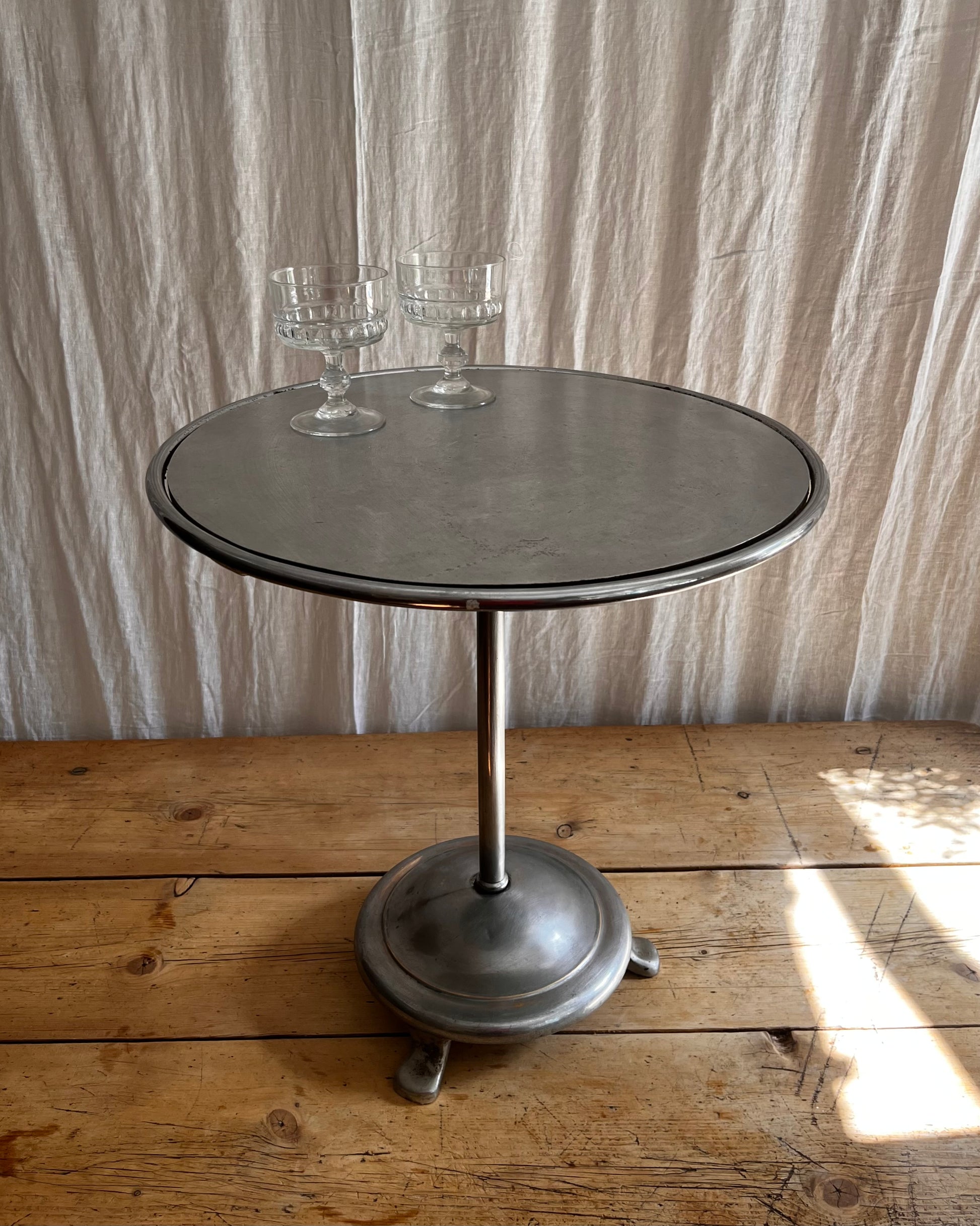 Vintage 1930s Art Deco stainless steel bistro coffee table with vintage french coupe glassware 