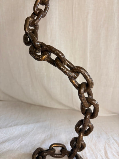 A Pair of Tall Coiled Chain Candle Holders