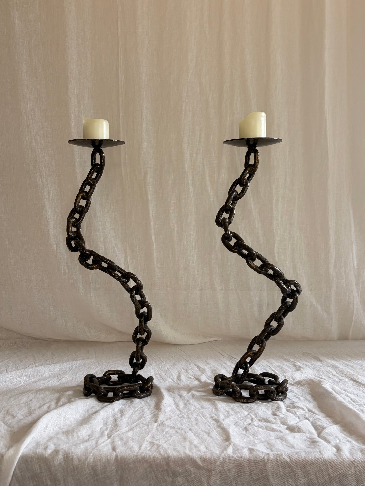 A Pair of Tall Coiled Chain Candle Holders