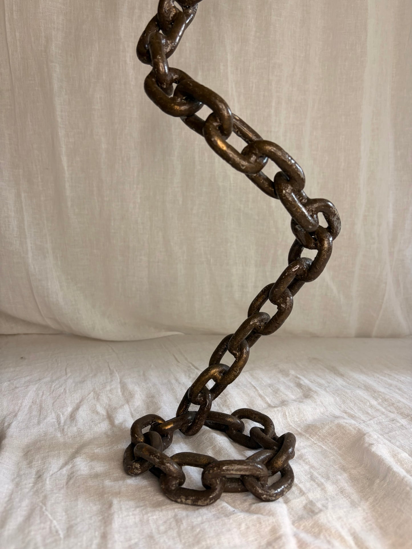 A Pair of Tall Coiled Chain Candle Holders