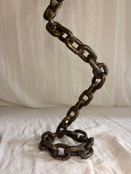 A Pair of Tall Coiled Chain Candle Holders