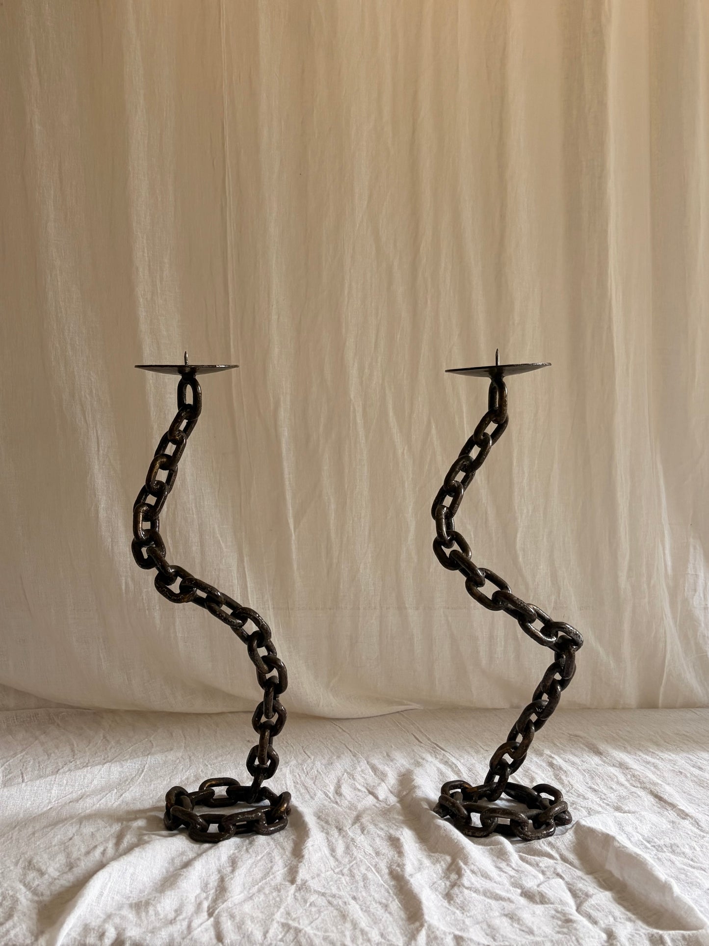 A Pair of Tall Coiled Chain Candle Holders