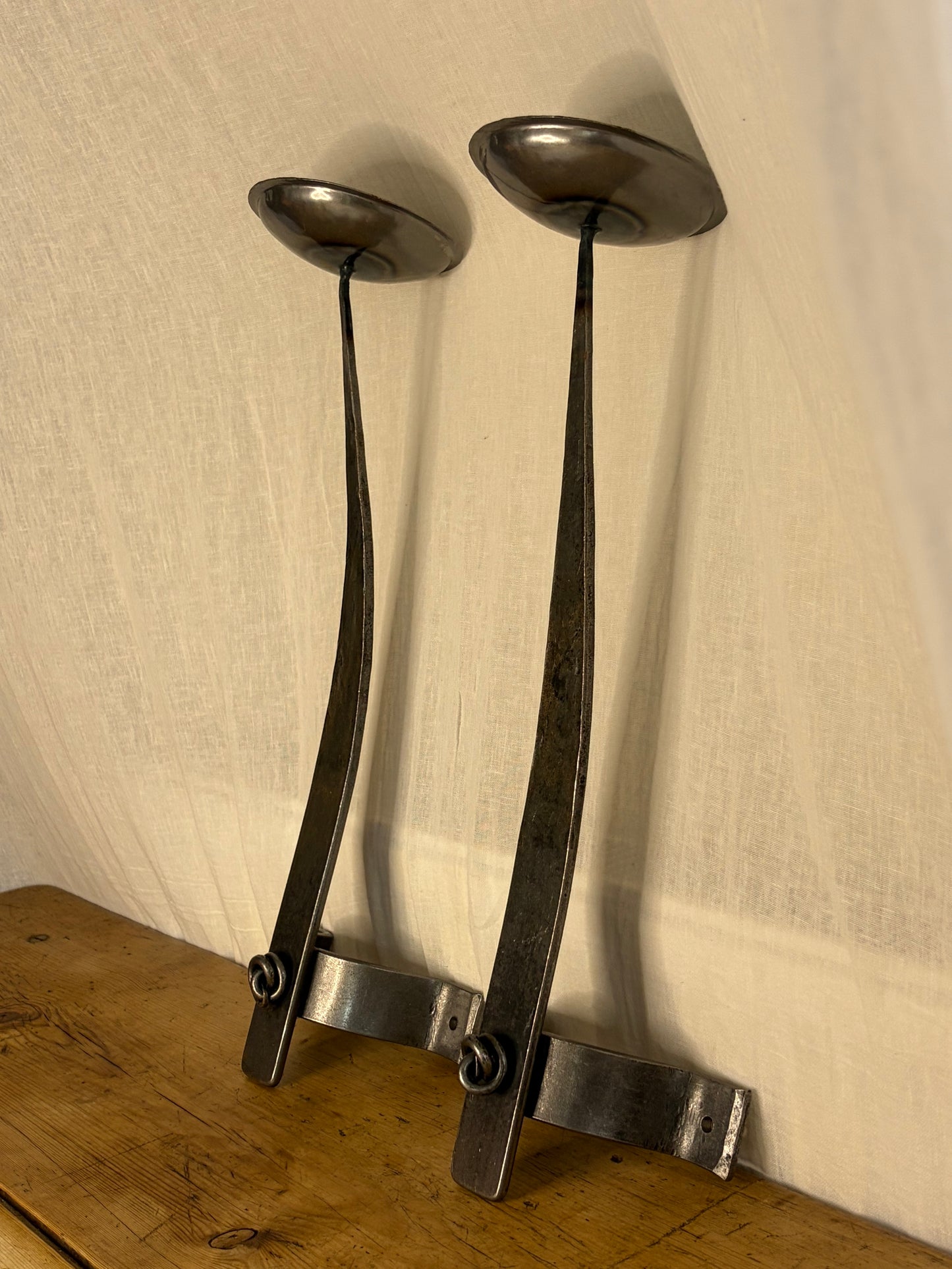 A Pair Of Forged Jacobean Style Candle Sconces