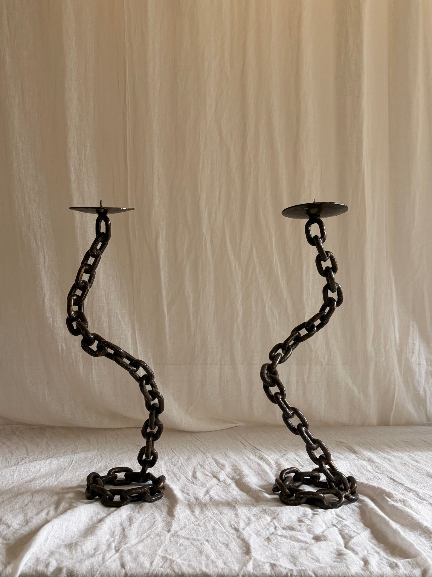 A Pair of Tall Coiled Chain Candle Holders
