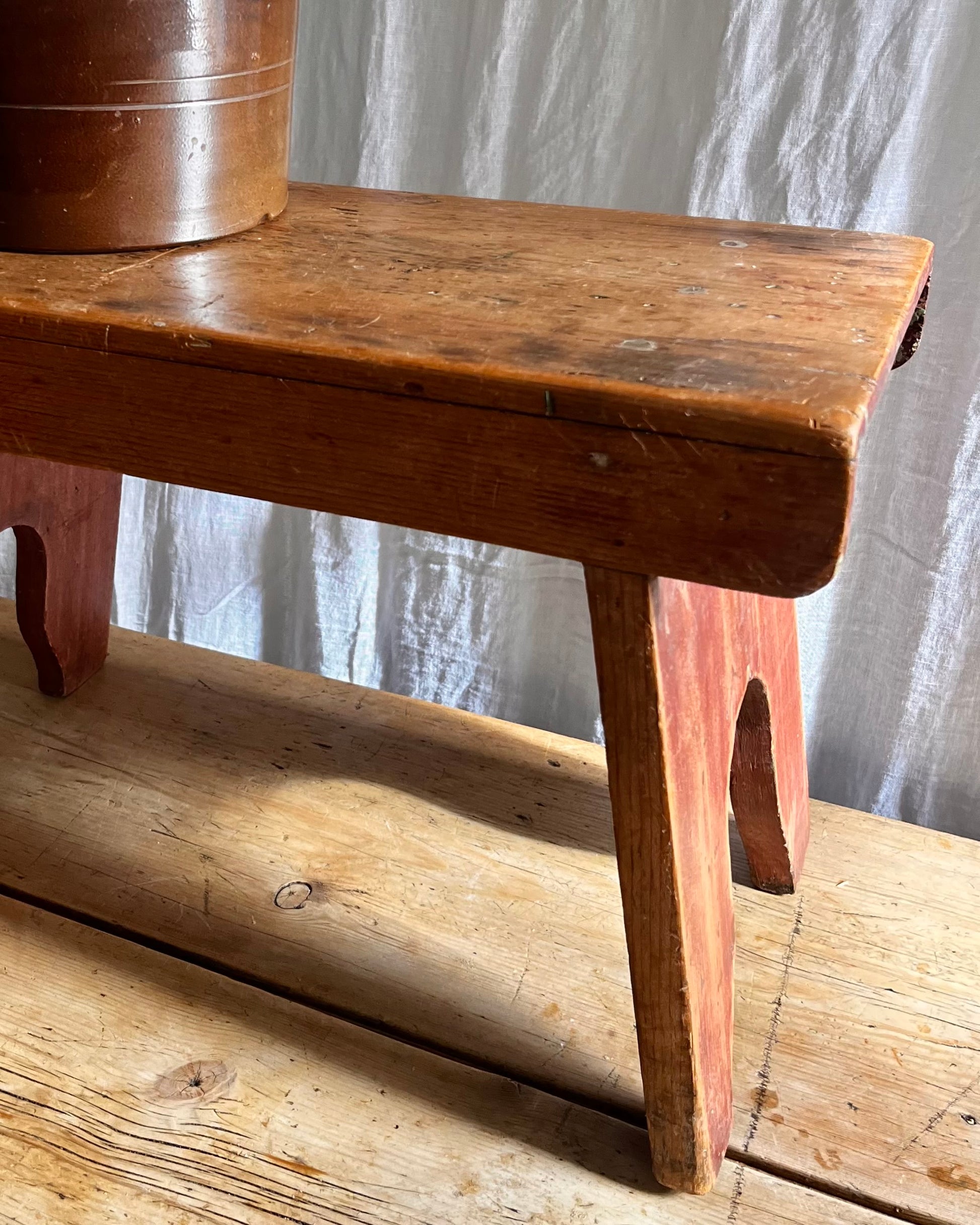 Antique country farm house wooden foot stool with a vintage french ceramic kitchen storage utensil holder
