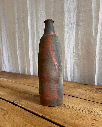 A Set Of French Clay Irregular Cider Bottles