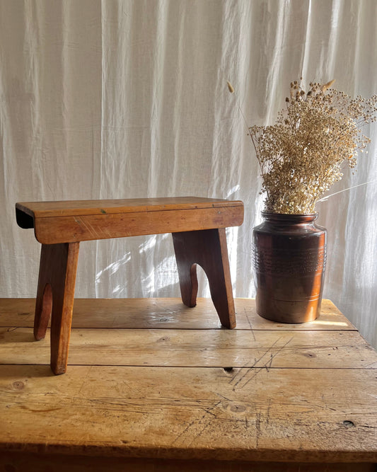 Antique country farm house wooden foot stool with a vintage french ceramic kitchen storage utensil holder